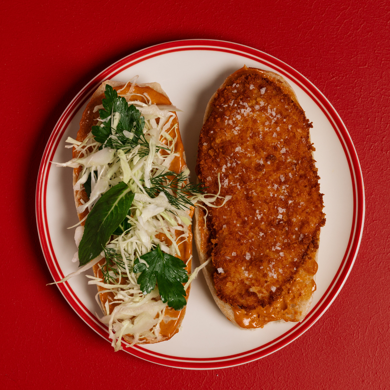 Crispy chicken schnitzel, white cabbage, house-made golf sauce, fresh ciabatta roll all made at Humble 