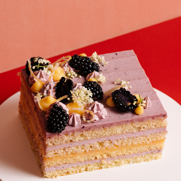 It’s decorated with fresh blackberries, elderflower, more blackberry mousse and candied Meyer lemon zest.
